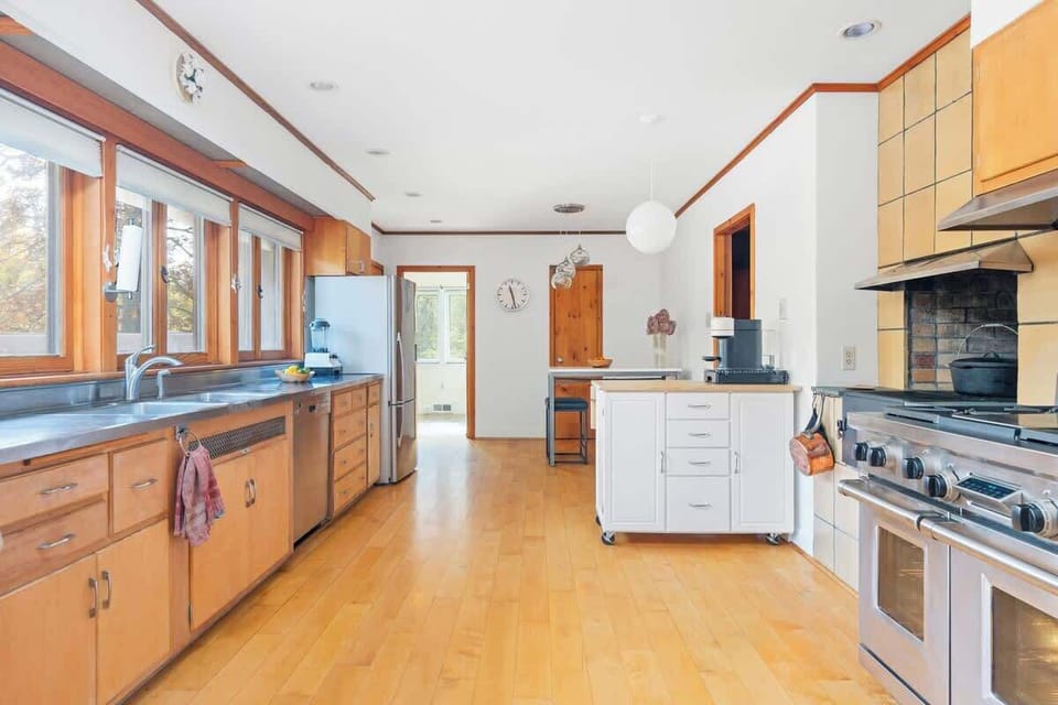 Chef's kitchen comes with a full batterie de cuisine, including Zwilling knives, Vitamix, Cusine Art food processor, Nespresso, micro zester, Wolf gas stove with six burners and two ovens, and much more.