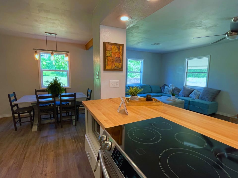 Open concept living/kitchen/dining space for socializing and entertaining.