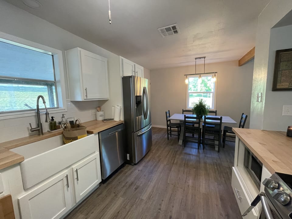 Brand new Samsung appliances and a spacious farmhouse sink for preparing meals.