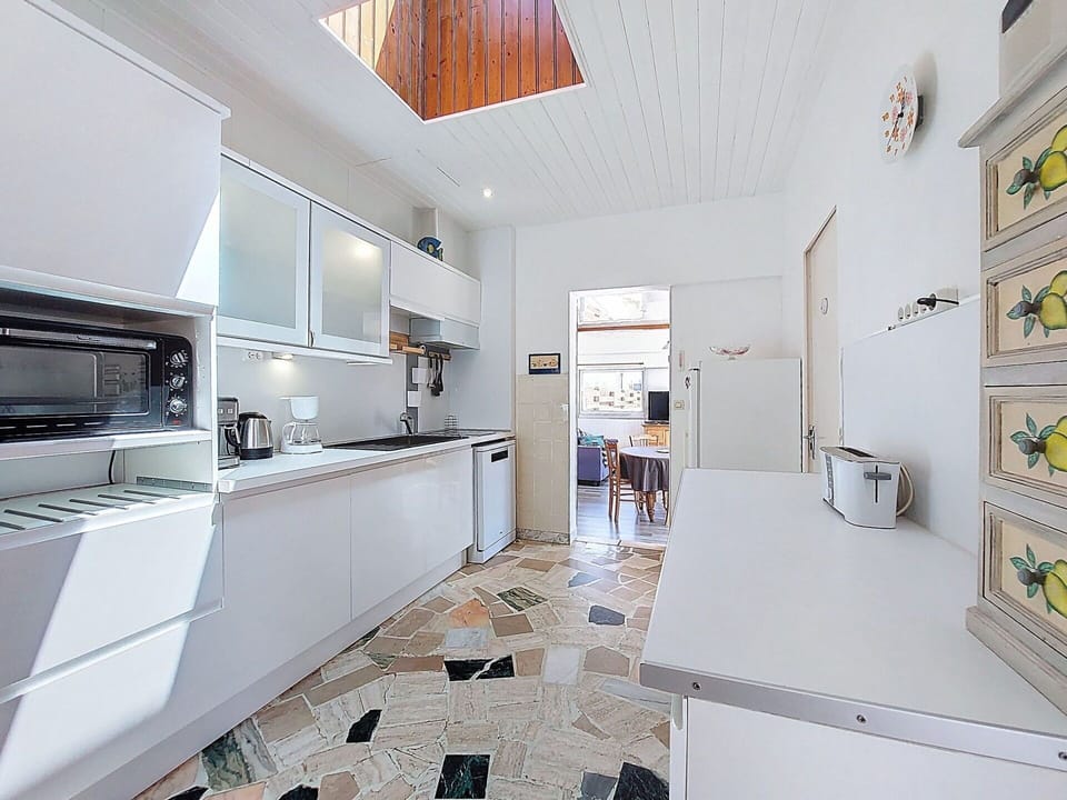 Flooring, Kitchen, Interior Design, Floor, Ceiling, Wood, Countertop, Major Appliance, Kitchen Appliance, Lighting