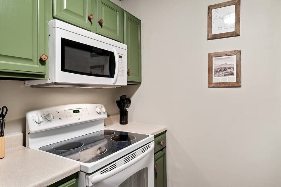 The kitchen is stocked with all the essentials - cutlery, plates, bowls, pots, pans and basic cookware. 