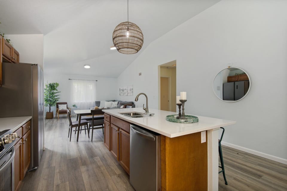 The renovated modern kitchen is fully equipped with new appliances and provides a perfect space for preparing meals during your stay.