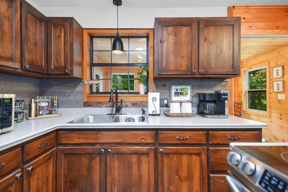 Kitchen with Keurig Duo coffee maker complete with coffee pods & creamer. 