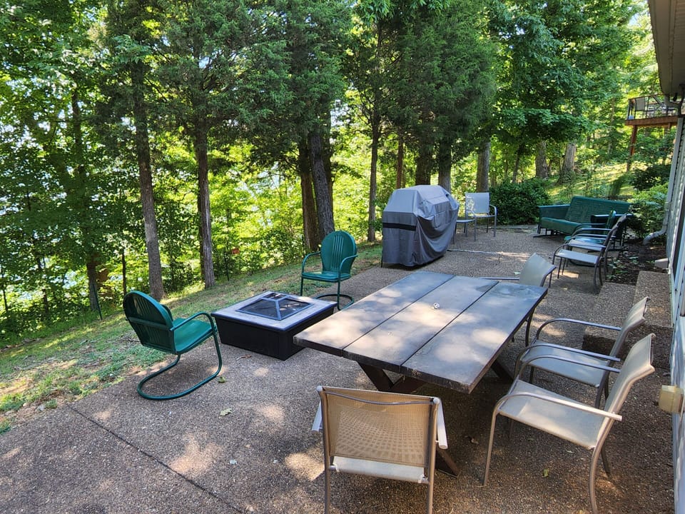 BBQ, firepit, lots of seating overlooking the lake