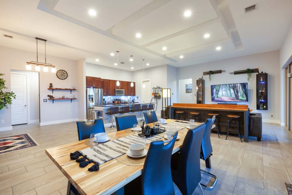 This home features 2 bar seating areas along with a dining table! 