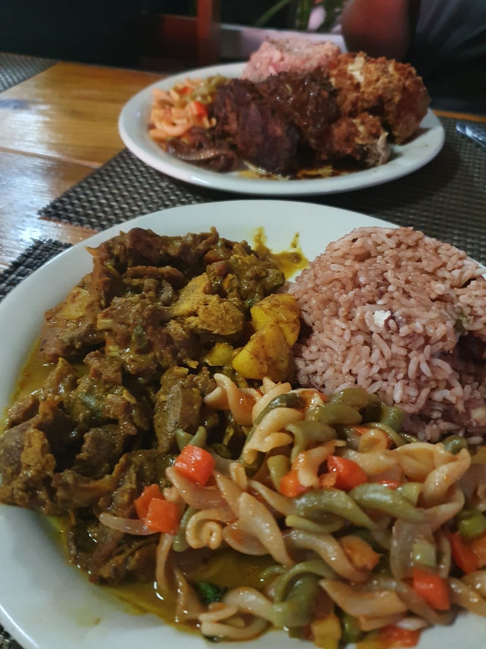 Curry chicken , fried chicken & rice and peas - yum ! Ask in- house cook