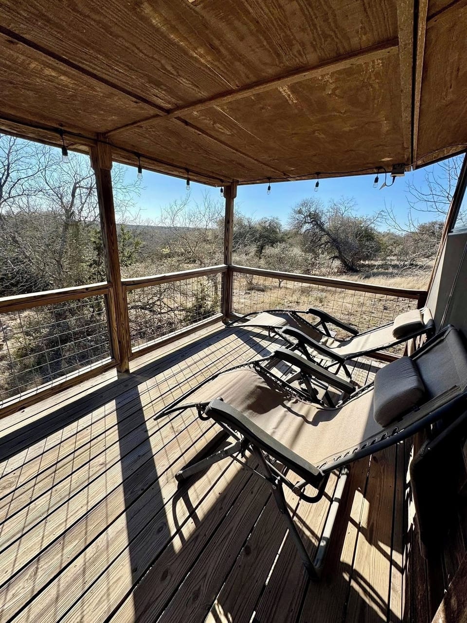 Enjoy the beautiful sunsets on the back porch from these comfy lounge chairs.