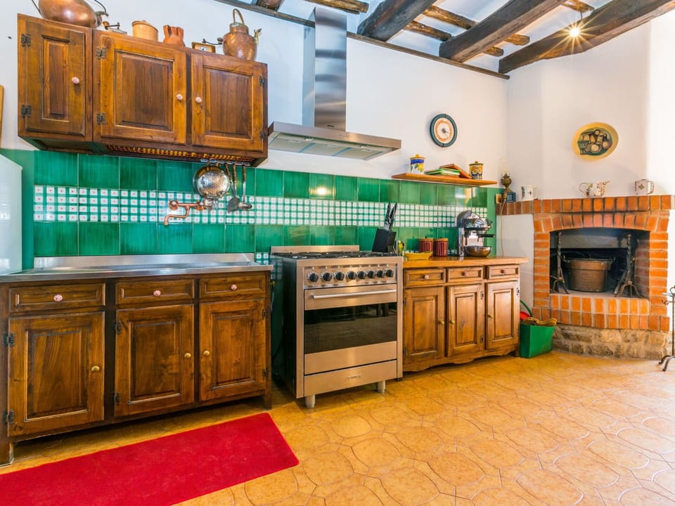 Countertop, Cabinetry, Property, Furniture, Kitchen, Drawer, Wood, Lighting, Kitchen Stove, Interior Design