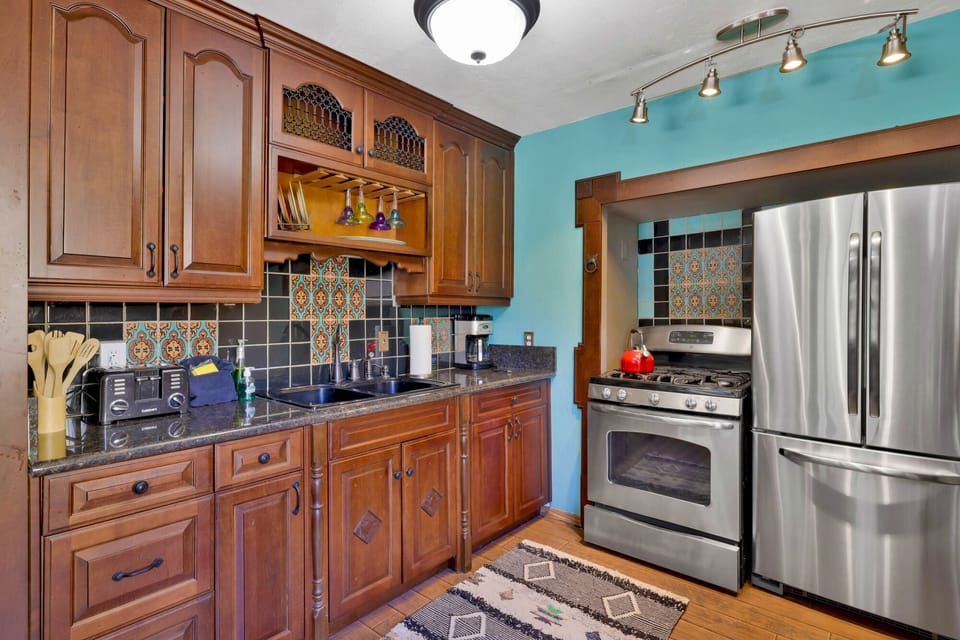 Fully equipped cabin kitchen with ample cabinetry, stove, fridge, microwave, and coffee maker—perfect for cooking meals, morning coffee, and feeling right at home on your stay.
