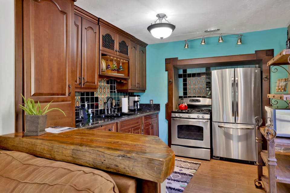 Fully equipped cabin kitchen with ample cabinetry, stove, fridge, microwave, and coffee maker—perfect for cooking meals, morning coffee, and feeling right at home on your stay.