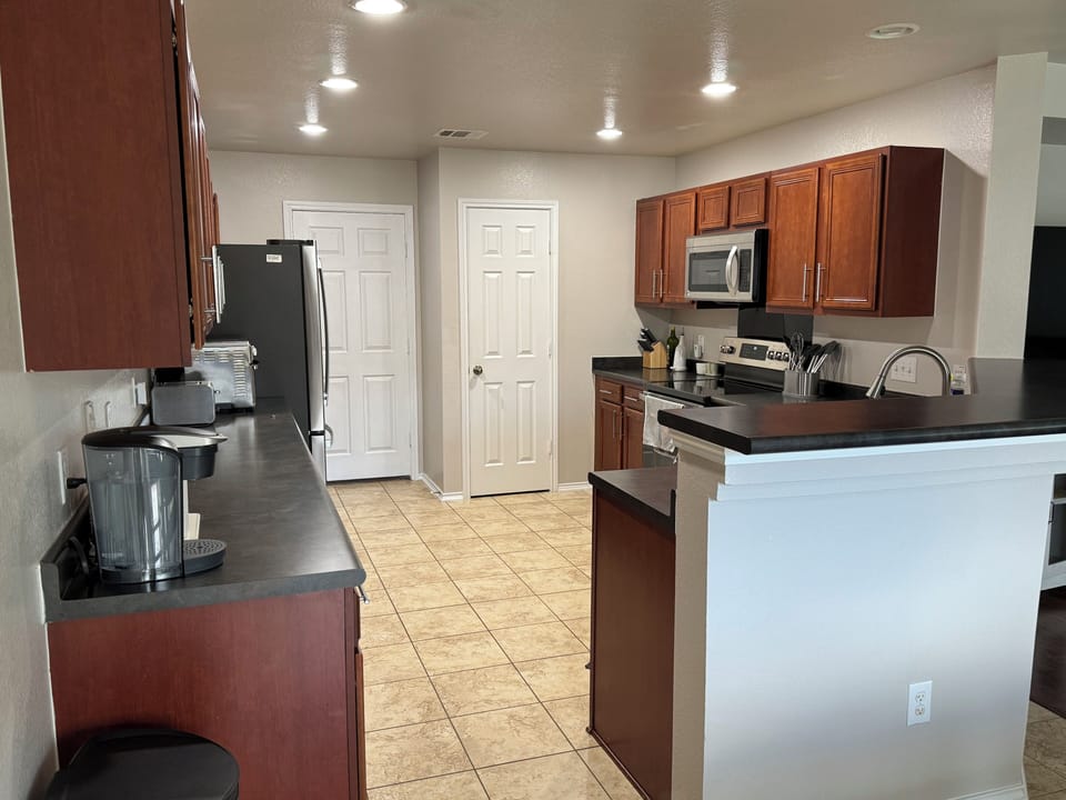 Well-equipped kitchen ready for cooking or baking.
