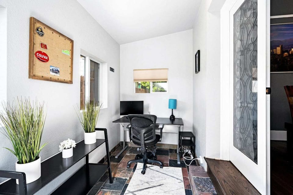 - Dedicated workspace with ergonomic chair, natural light, and reliable setup
- Ideal for remote work, study time, or catching up on travel planning
- Decor and slate tile keep the vibe stylish while the space stays functional

