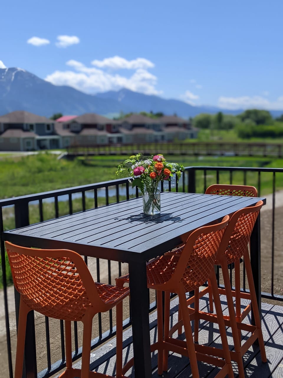 High top table for enjoying a cocktail or meal while enjoying the mountain view 
