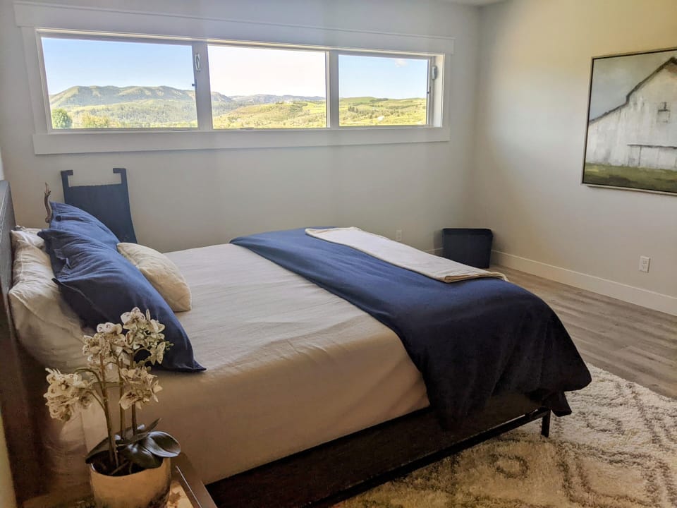 Enjoy mountain views from bed