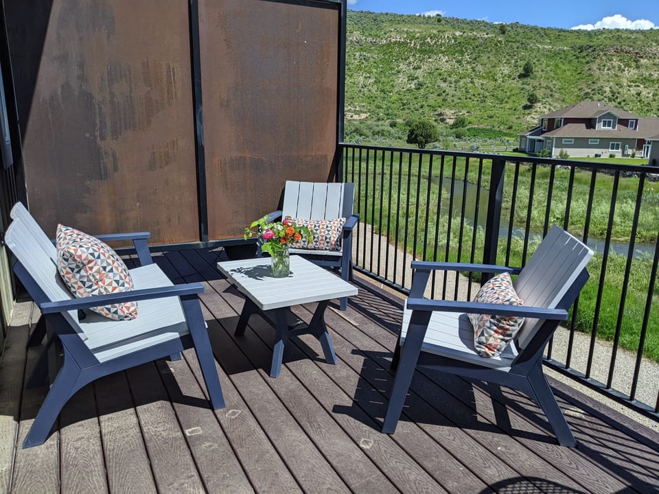 Outdoor area to lounge while listening to the soothing sounds of Rainey Creek