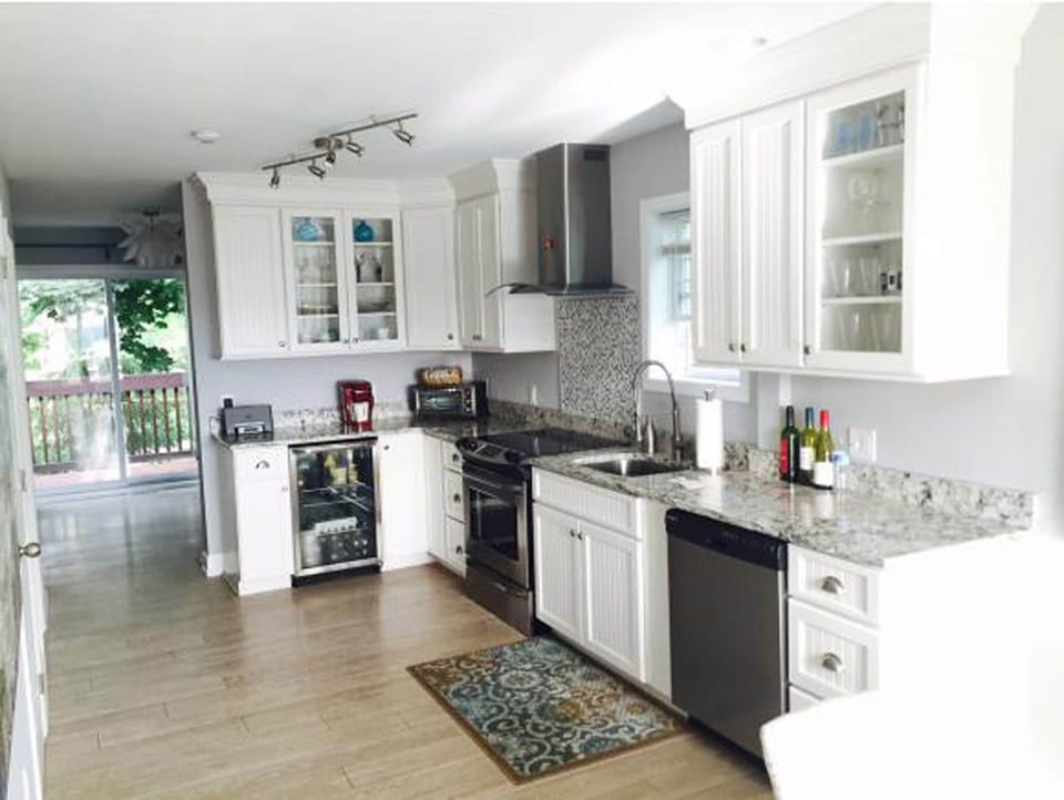 Kitchen through to Living room and Back Deck. Modern fully renovated Kitchen.