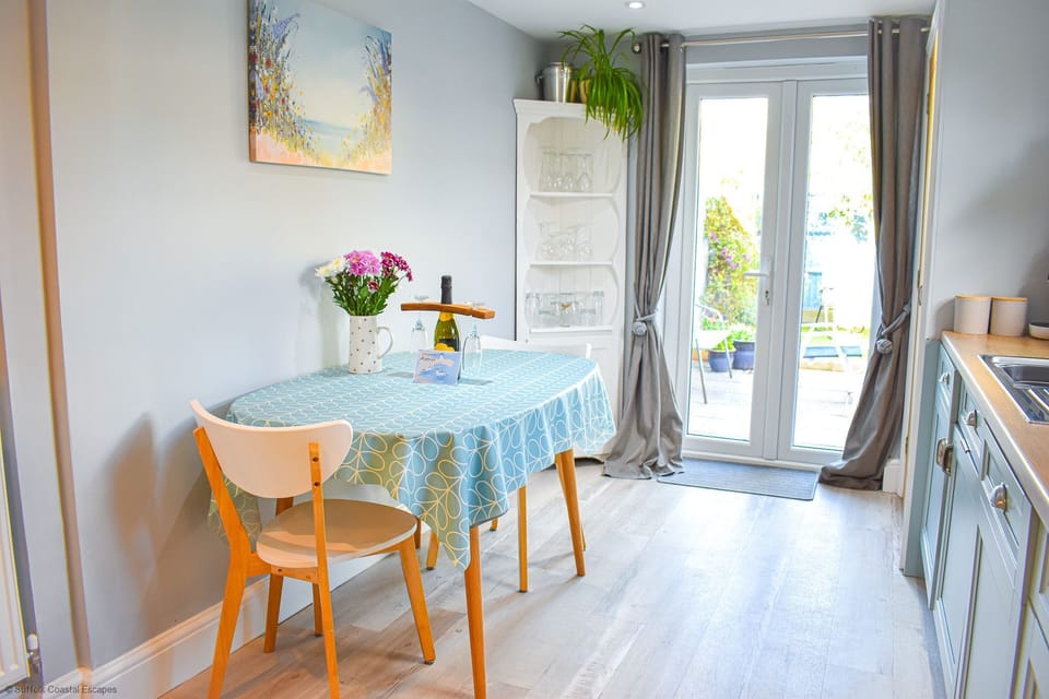 Dining area and french doors leading out to the enclosed garden