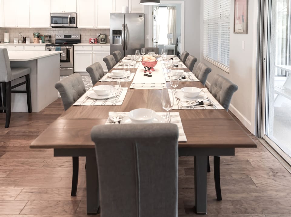 The LARGE dining table is a focal point -  perfect for meals or game night!