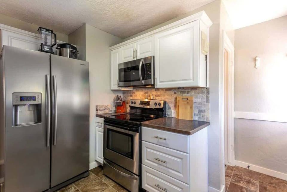 Fully stocked kitchen with updated stainless appliances