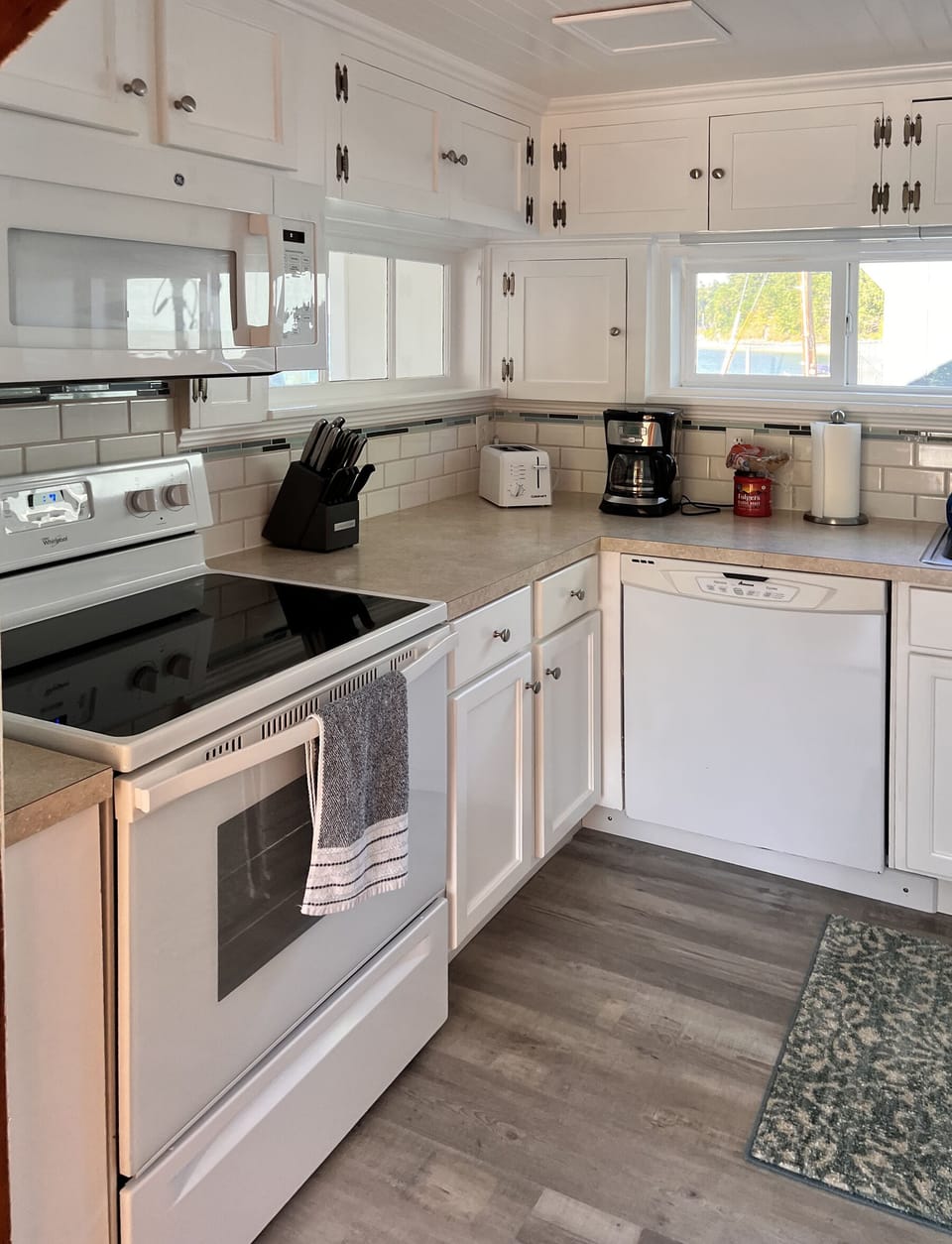 Kitchen with microwave, coffee maker, toaster.