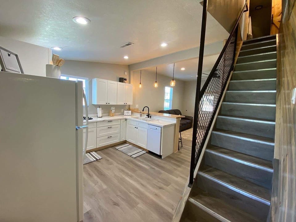 Head up the stairs into the tree house-like second story complete with 2 bedrooms & full bathroom