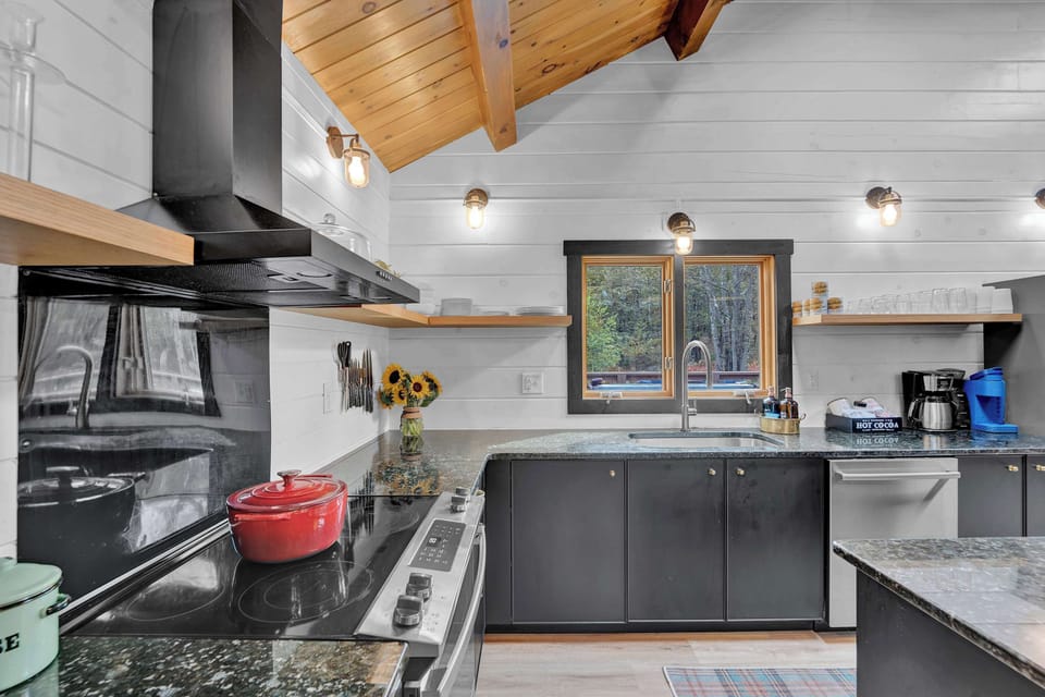Long granite counters, a deep 30" sink, and all-new kitchen equipment make cooking and cleanup a pleasure.  