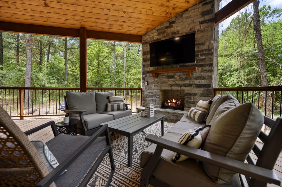 Outdoor fireplace. Great views of the yard, fire pit, and hot tub.  