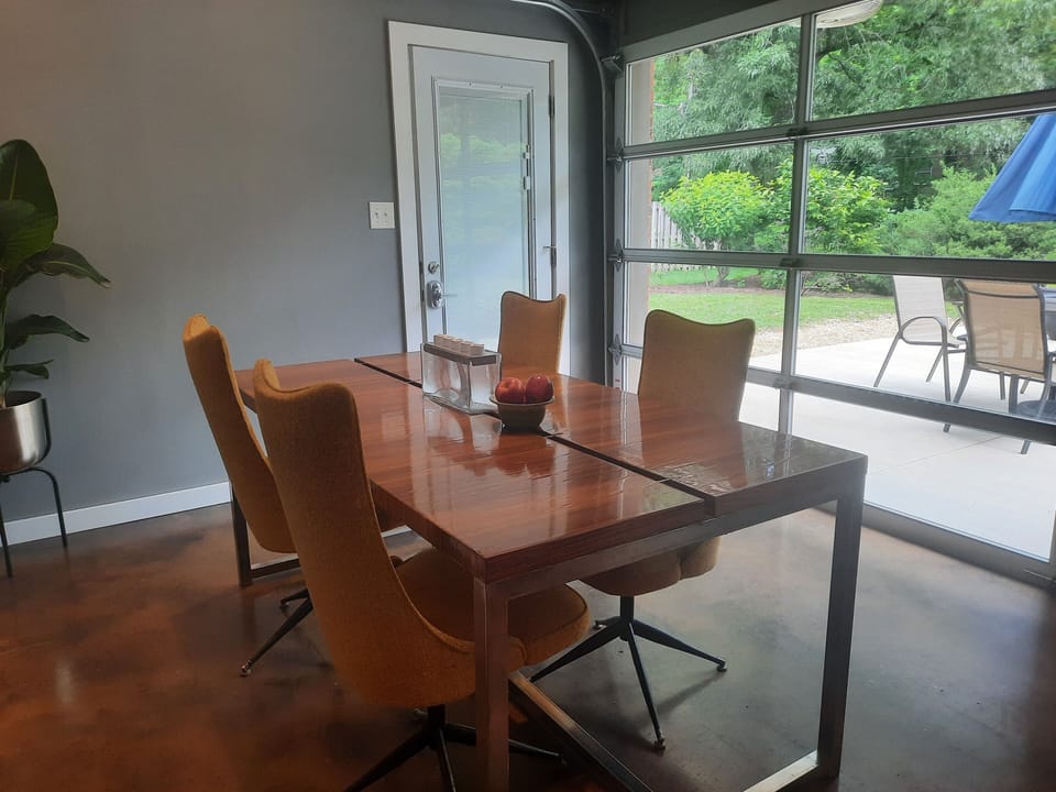 Dining room with glass door.  Inside dining with outside vibes.