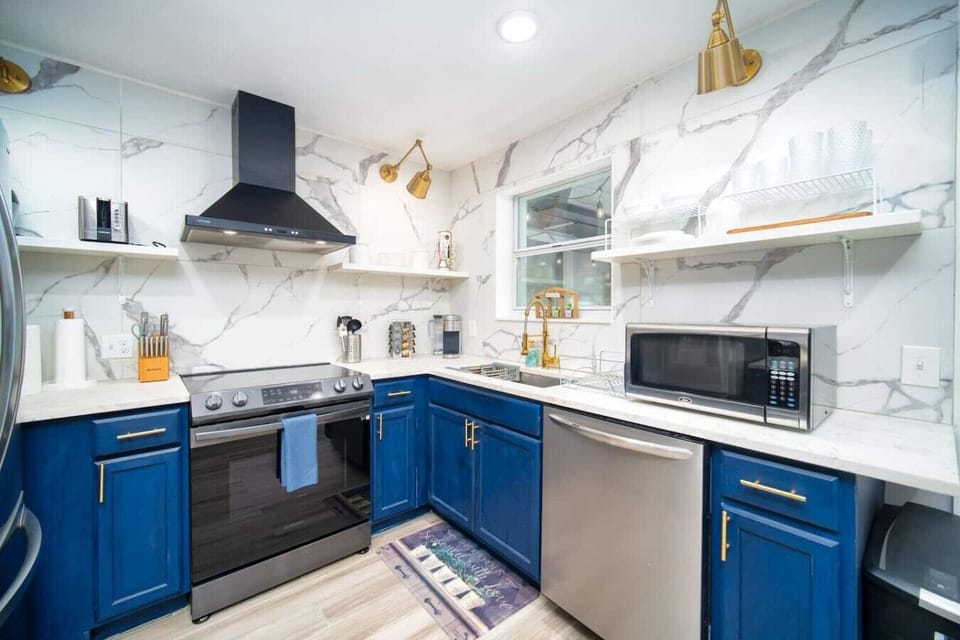 Cook up your favorite meals in this stylish and fully equipped kitchen, featuring modern appliances and marble accents~