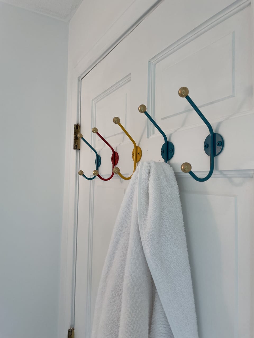 Hooks on bathroom and all bedroom  doors for towels.