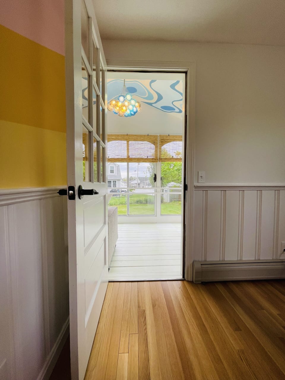 View from dining room to porch - your new favorite spot for morning coffee 
