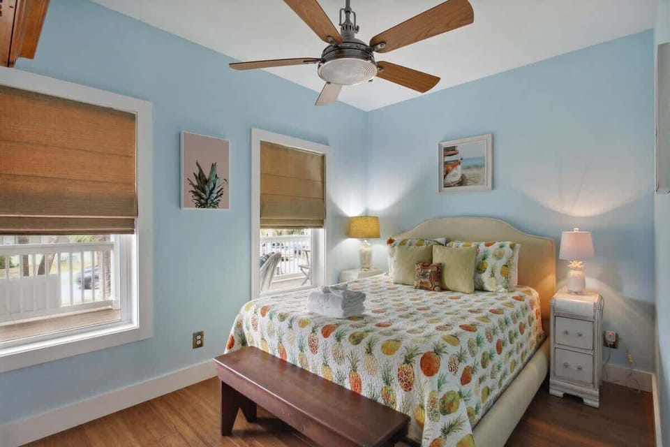 The Pineapple bedroom on 2nd floor has a queen bed and smart TV. Full bathroom is beside.
