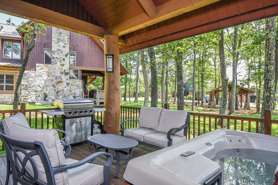 Back patio covered with grill, hot tub