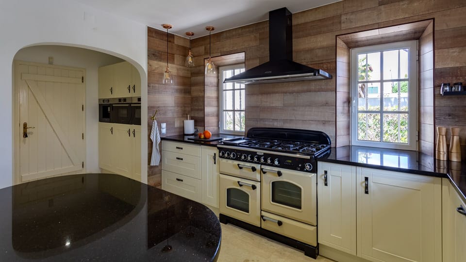 Kitchen area with larger gas stove