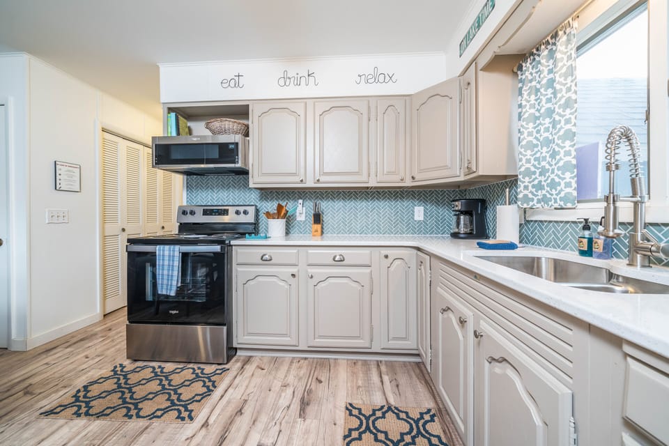 Well stocked, including pots/pans/dishware, drip coffee maker, toaster, and more