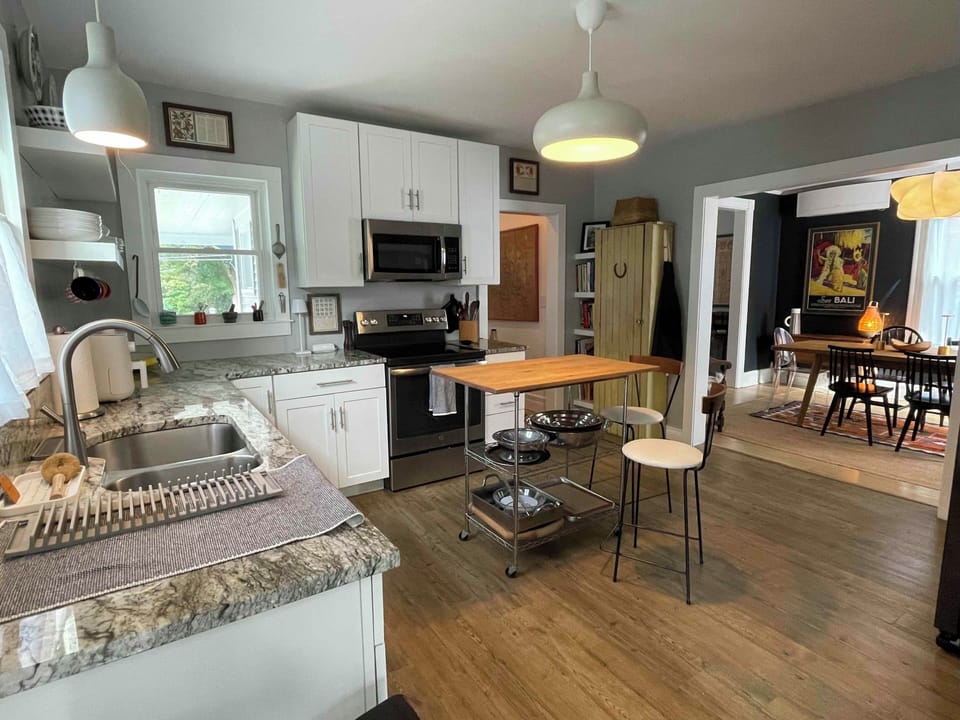 Our well-equipped kitchen opens to the dining room