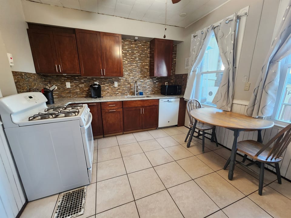 Beautiful eat in kitchen with granite surfaces. 