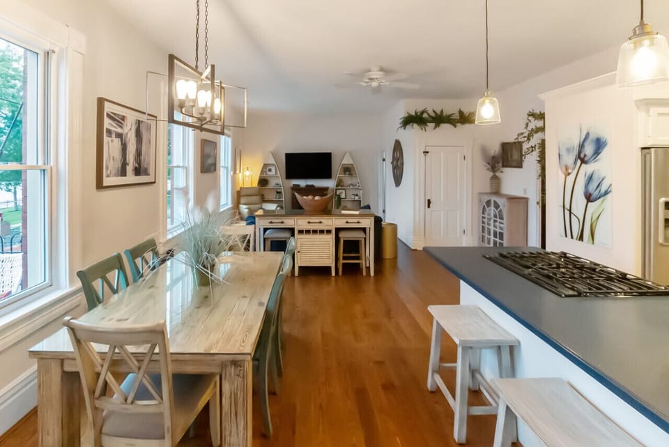 Open kitchen, dining, and living space with river views