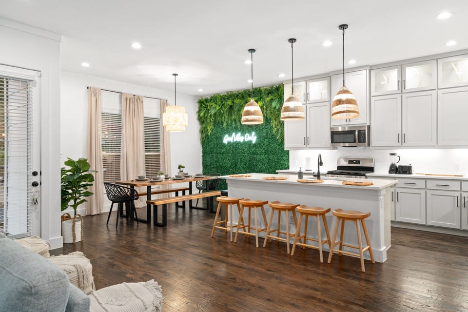 Open concept layout featured throughout the living, dining and kitchen. 