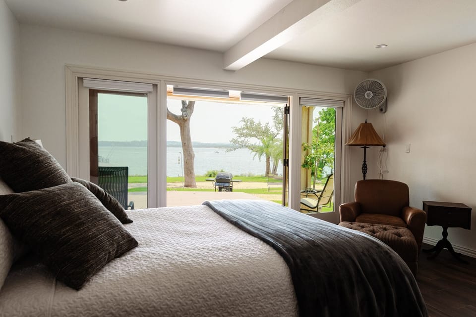 Spacious king bed where the views continue.  The spa is just outside the bedroom