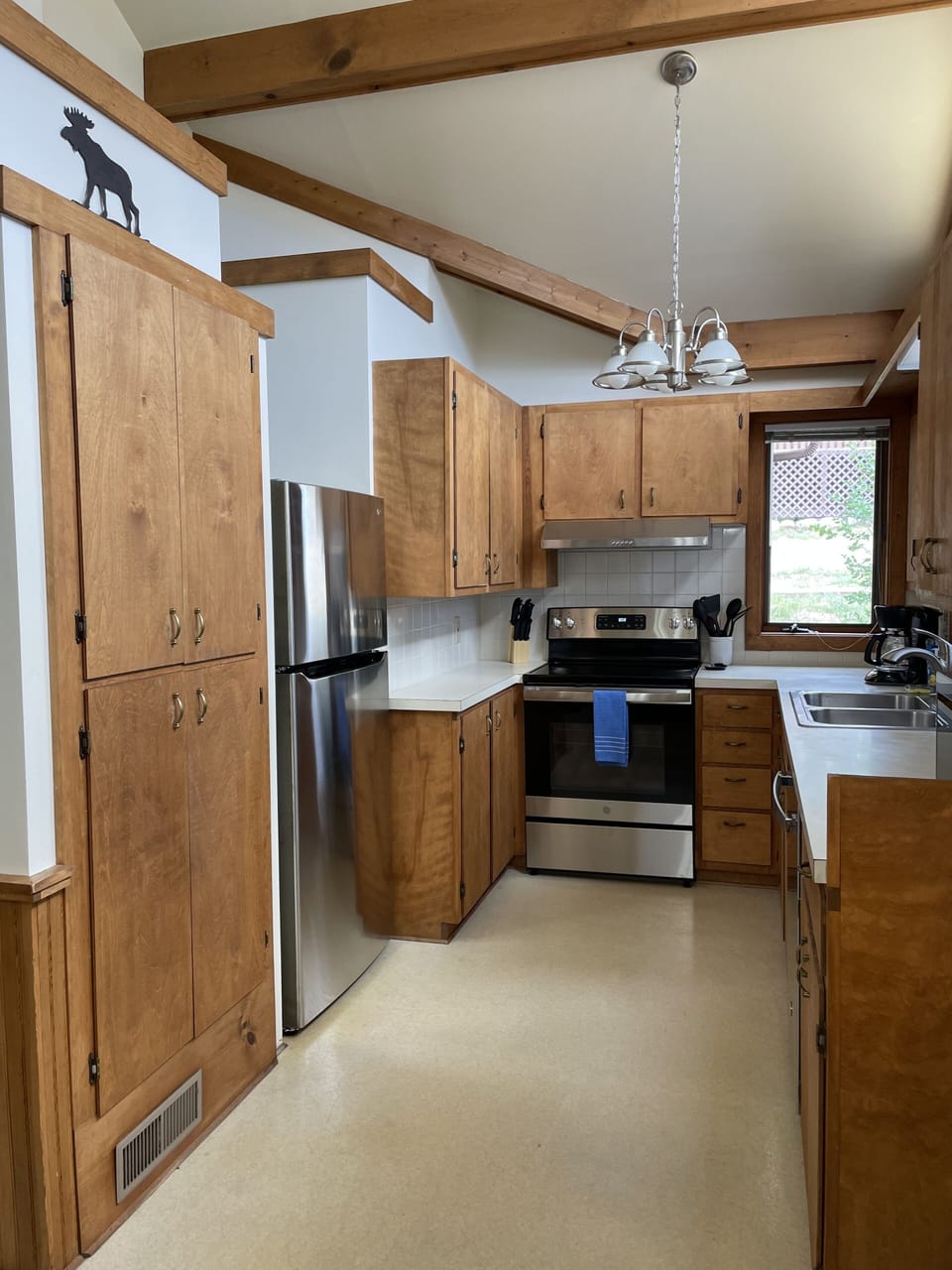 Full kitchen w/ fridge, ice maker, glass top electric stove and oven. 