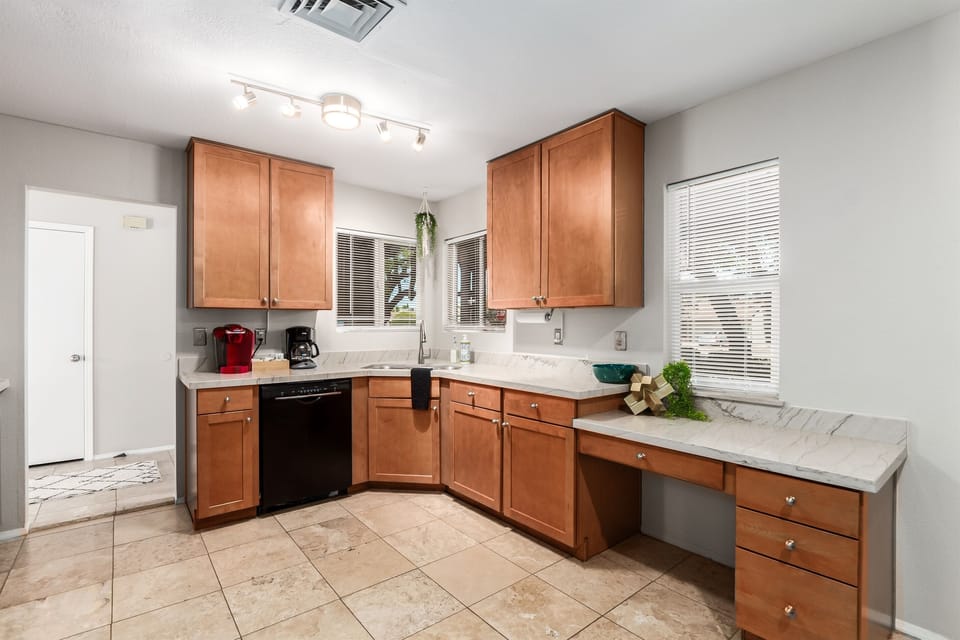 Kitchen is equipped with a dishwasher, coffee maker, Keurig and more