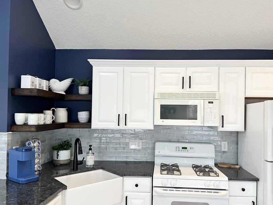 Fully equipped kitchen with dishwasher. Keurig and a drip coffee maker.