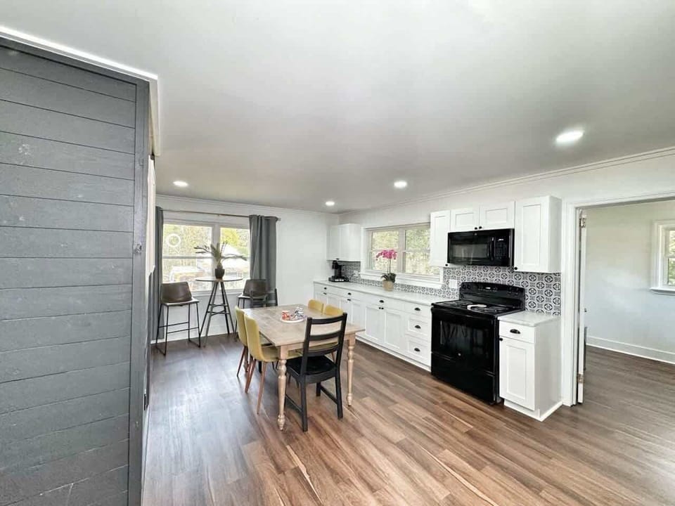 Bright, airy great room with breakfast bar.