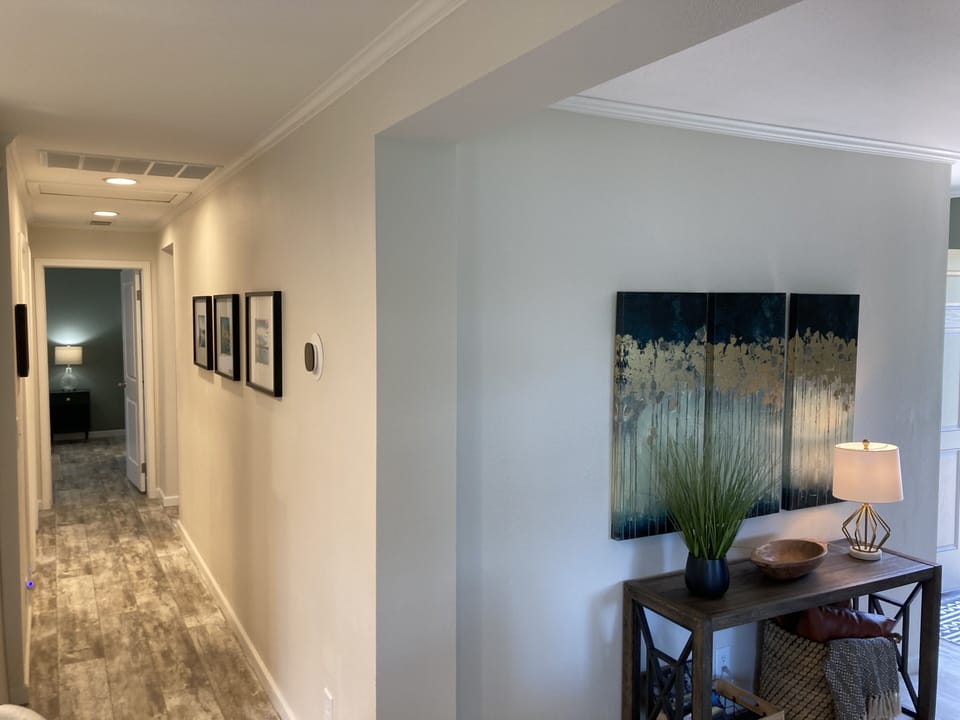 Hallway to bathroom and 3 bedrooms