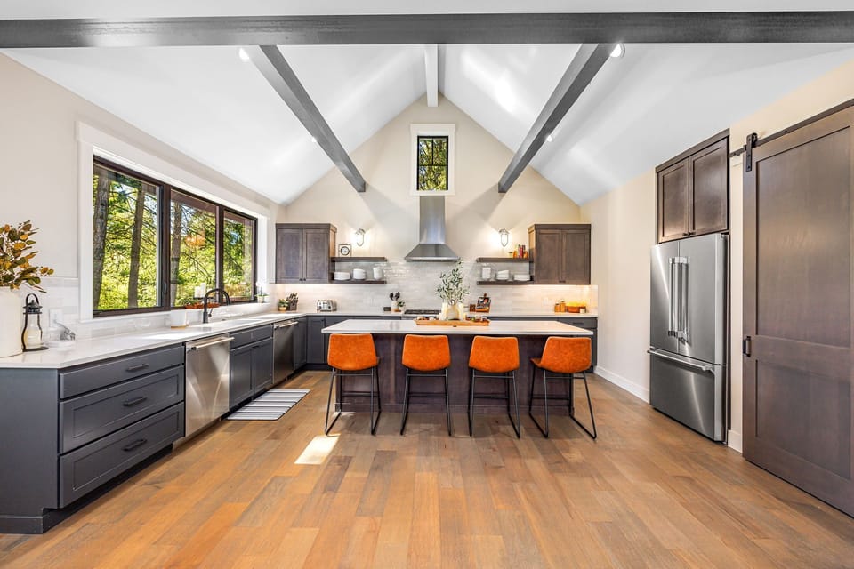 The kitchen features a spacious layout with an open concept design