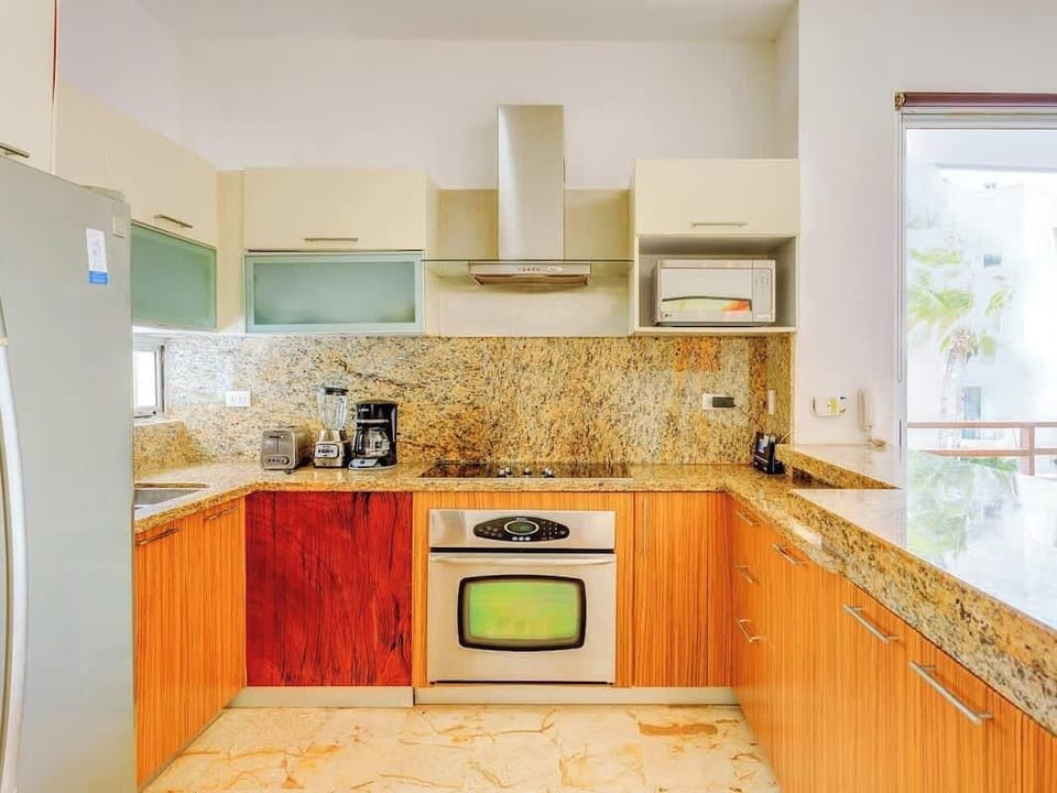 Modern kitchen with granite countertops and stainless steel appliances