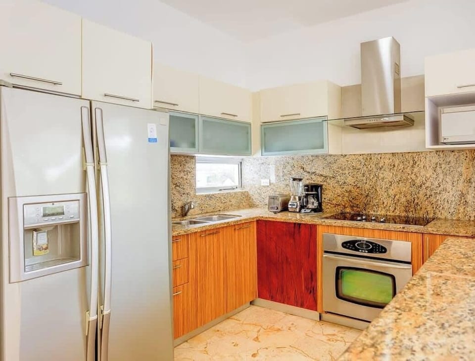 Modern kitchen with granite countertops and stainless steel appliances