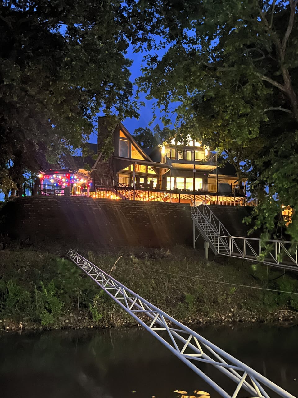 View of house at night from dock