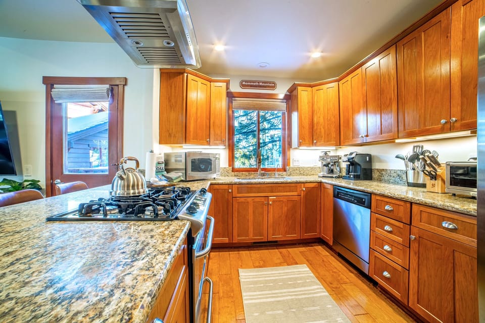 Kitchen with stainless steel appliances and gas stovetop.